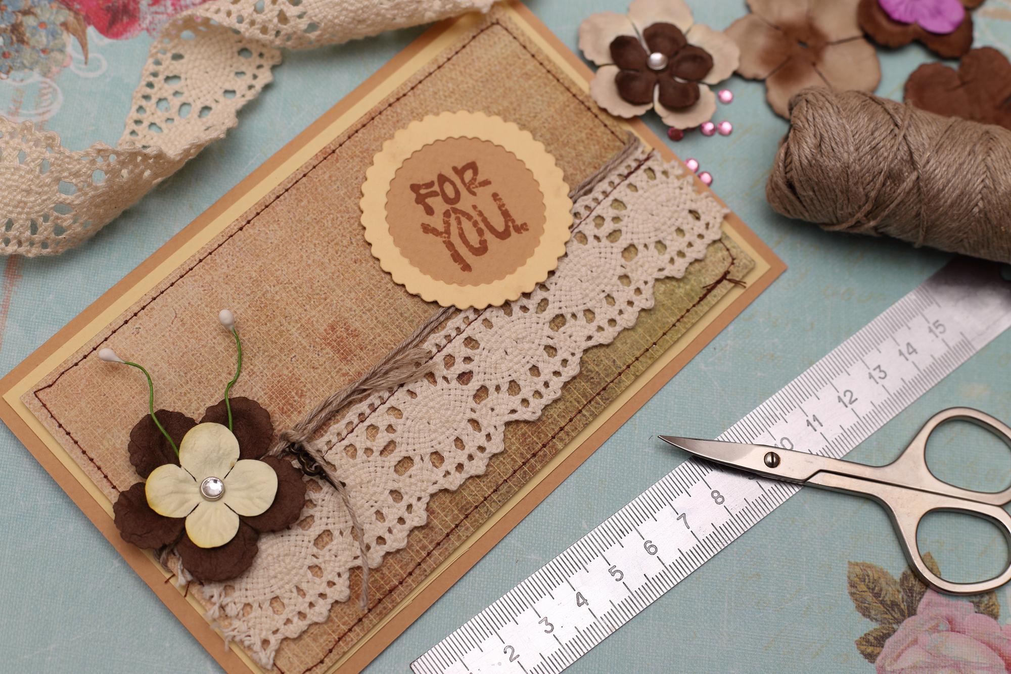 Series of embroidered badges on kraft paper
